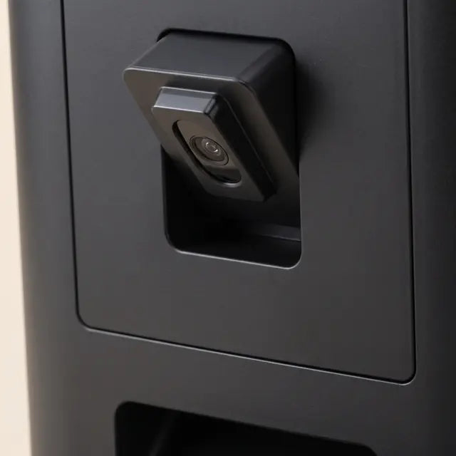 Close-up of the feeder's camera, set into the front panel above the food outlet.